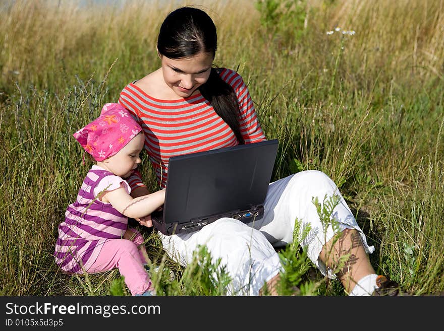 Happy family relaxing on meadow. Happy family relaxing on meadow