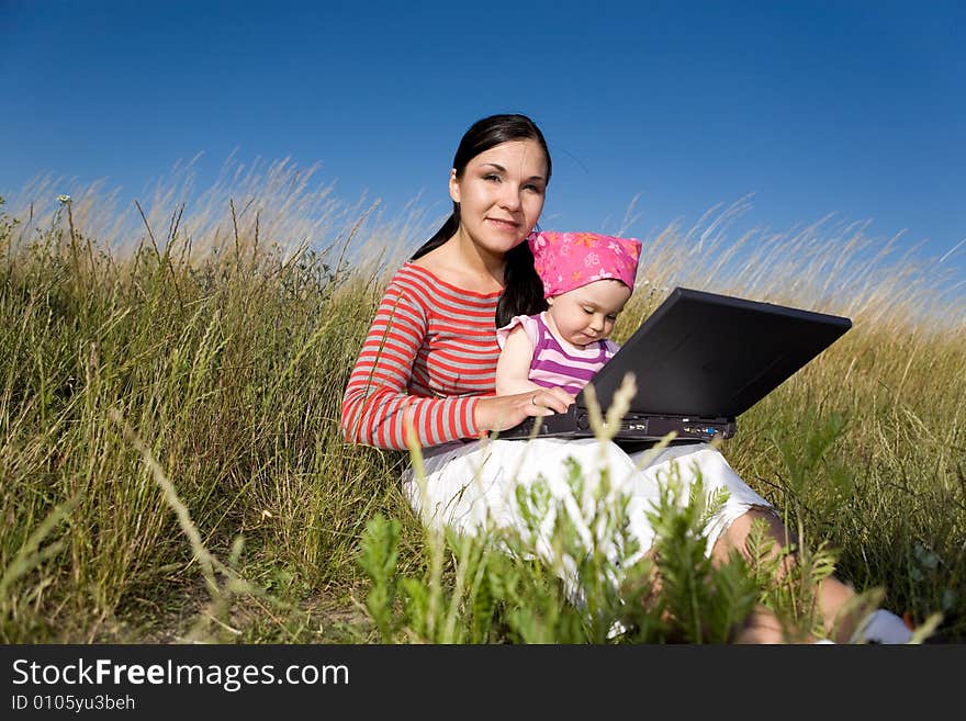 Happy family relaxing on meadow. Happy family relaxing on meadow