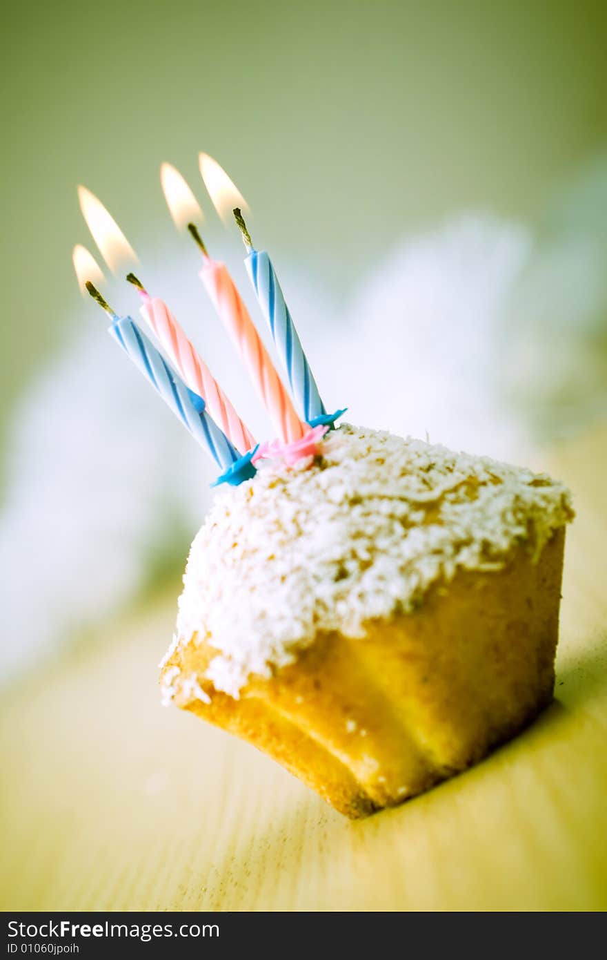 Birthday cupcake with four candles