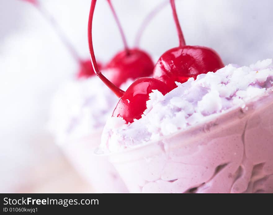 Small cakes with cherryon white plate