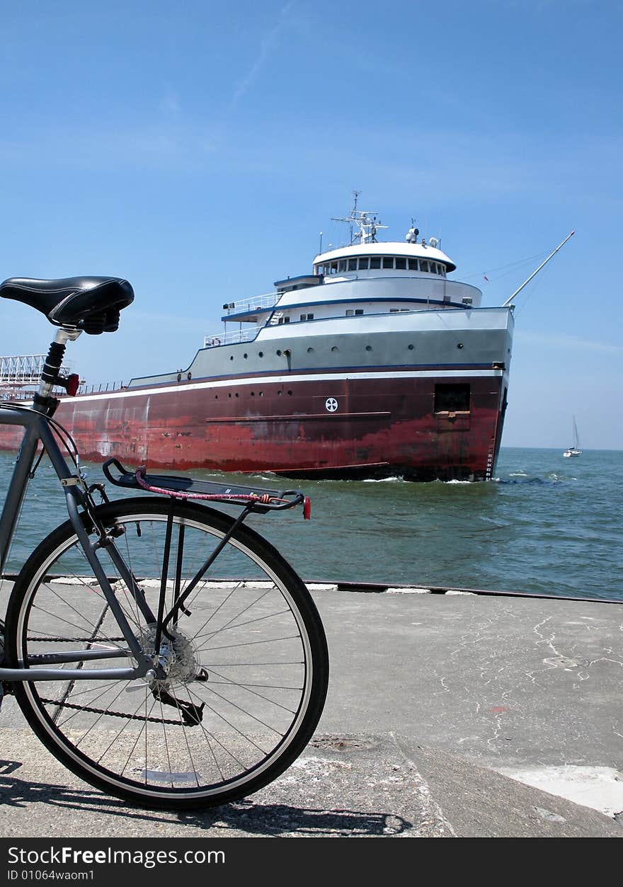 Bicycle and freighter in the harbor. Bicycle and freighter in the harbor.