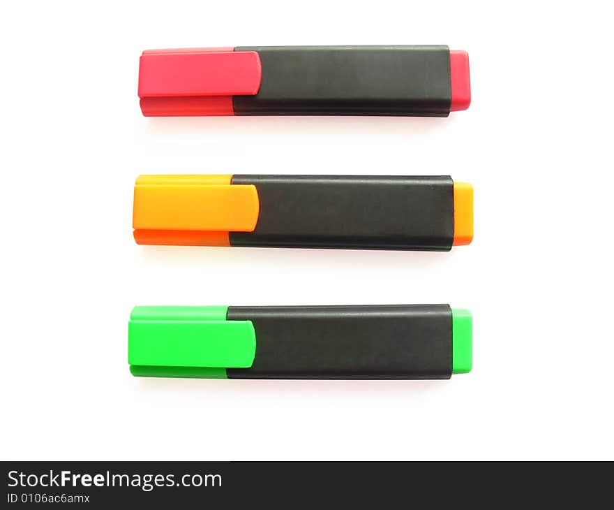 Three markers on a white background