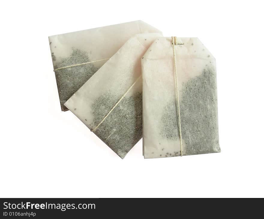 Three teabags on a white background. Three teabags on a white background