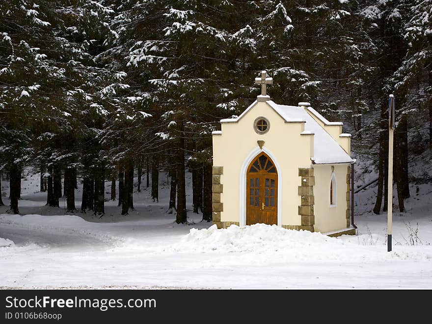 Small chapel in a snow-covered wood. Small chapel in a snow-covered wood