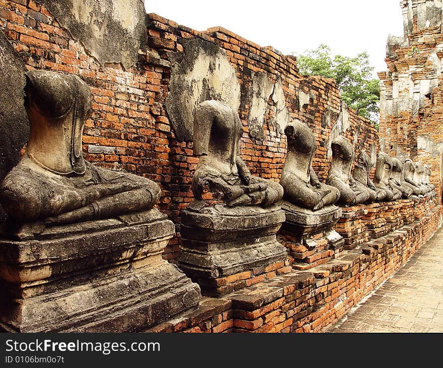 Damaged beheaded or Headless buddha statues in temple of Wat Chai Wattanaram in Ayutthaya near Bangkok, Thailand. Damaged beheaded or Headless buddha statues in temple of Wat Chai Wattanaram in Ayutthaya near Bangkok, Thailand