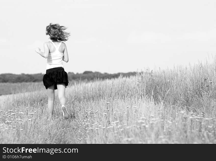 A beautiful girl running on the field