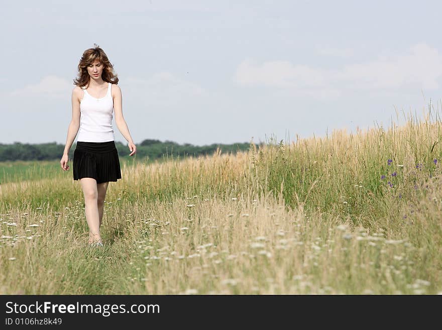 A beautiful girl running on the field