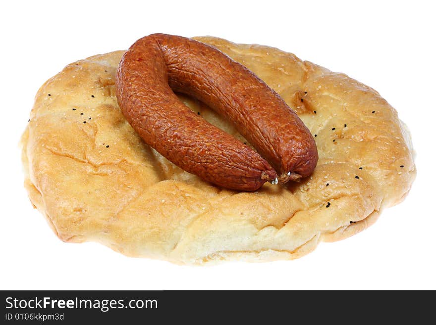 Flat bread with smoked sausage on a white background. Flat bread with smoked sausage on a white background.