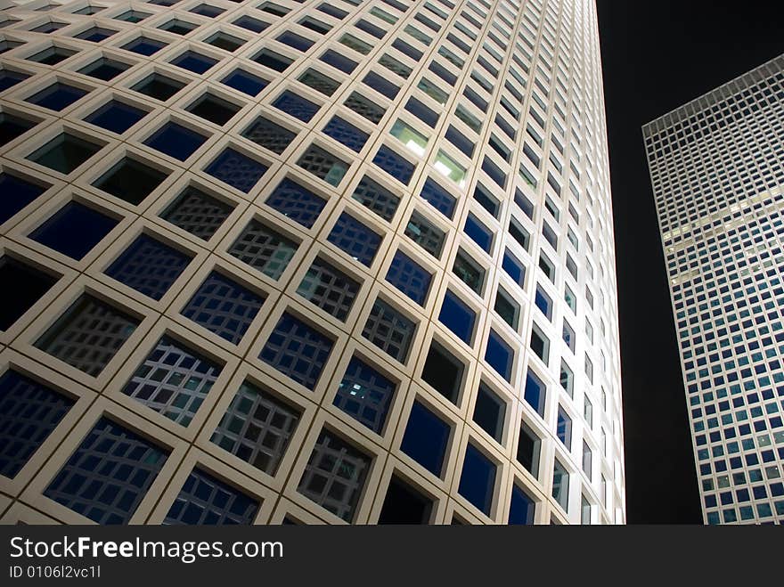 A complex of scyscrapers in Tel-Aviv Israel with a projector ligh towords the next building. A complex of scyscrapers in Tel-Aviv Israel with a projector ligh towords the next building