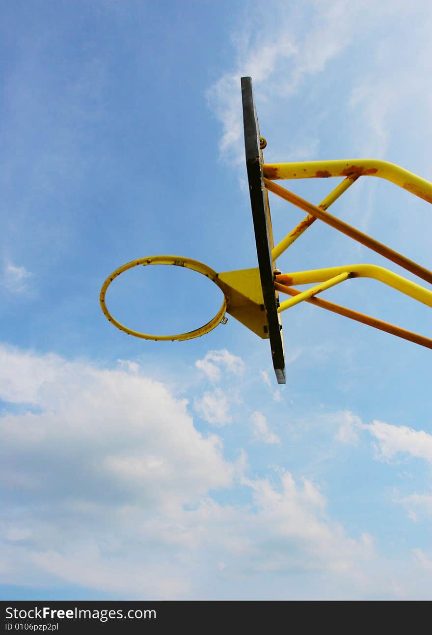 The backboard with a blue sky background .