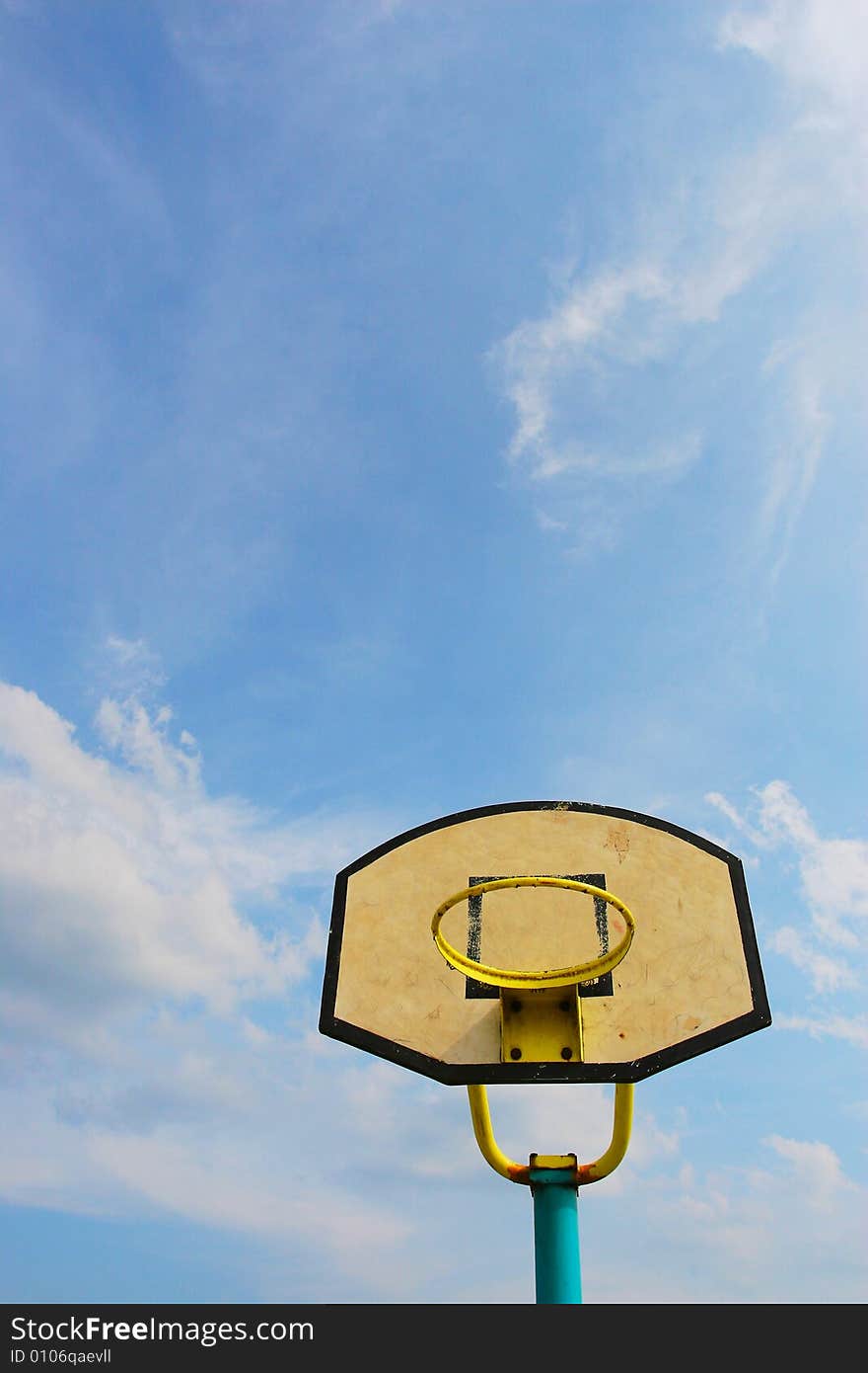 The backboard with a blue sky background .