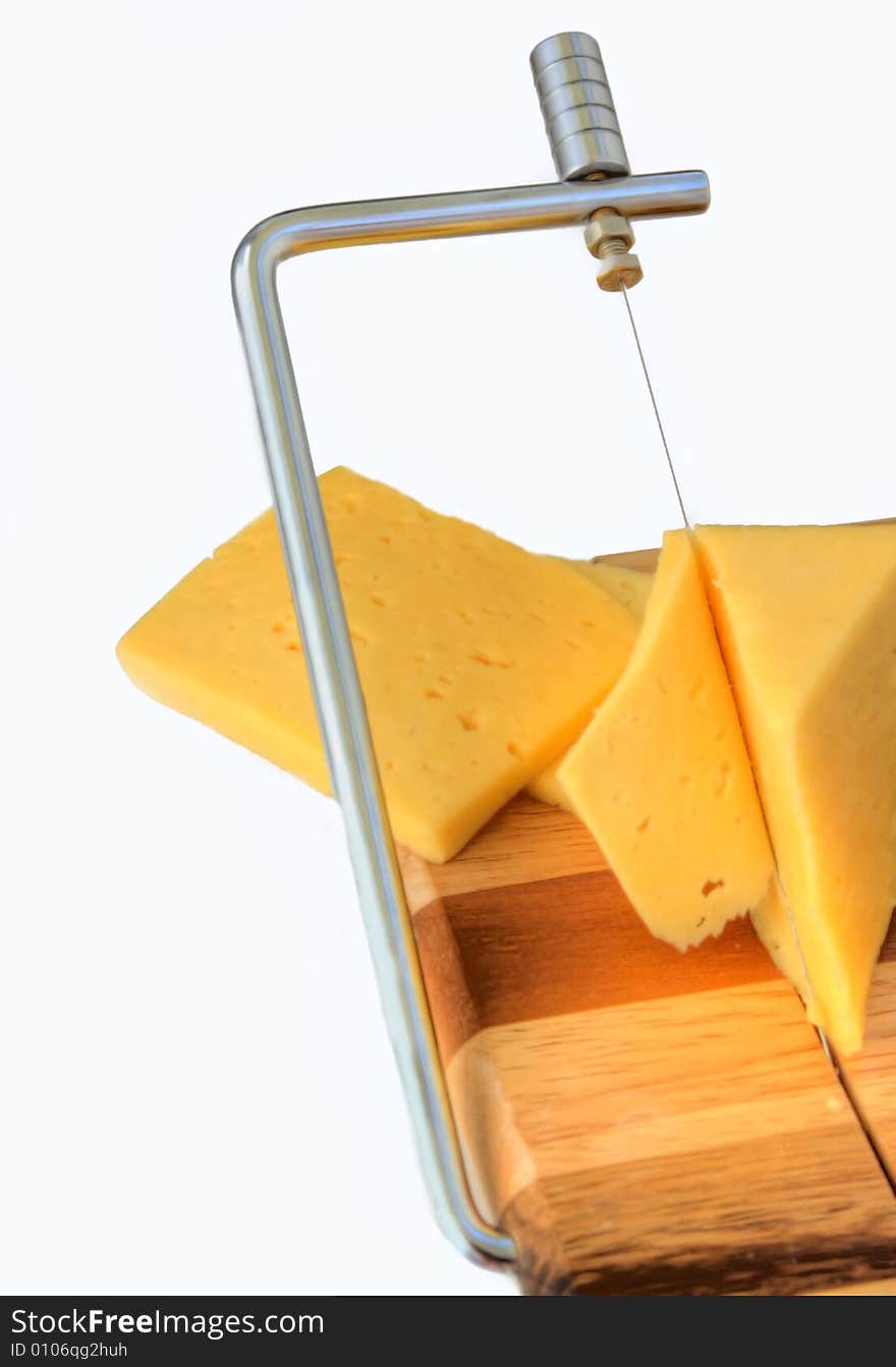 Board for cutting cheese and cheese on a white background