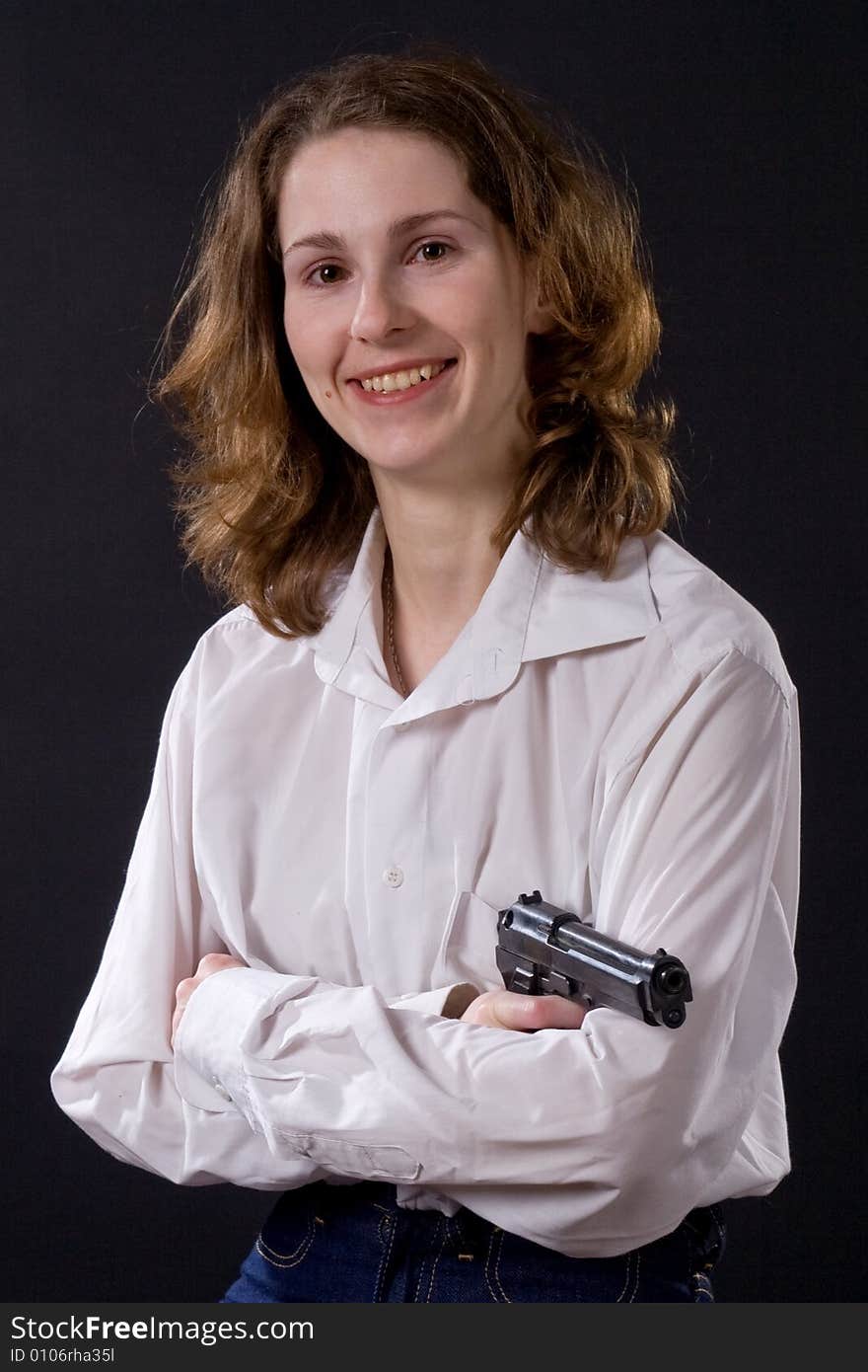 Woman on black handing gun. Woman on black handing gun