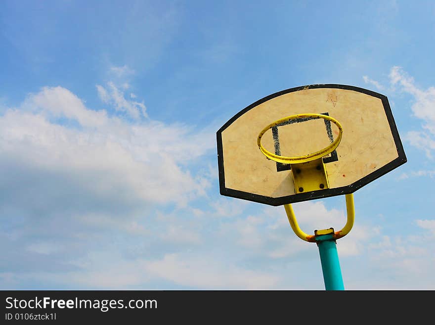 The backboard with a blue sky background .