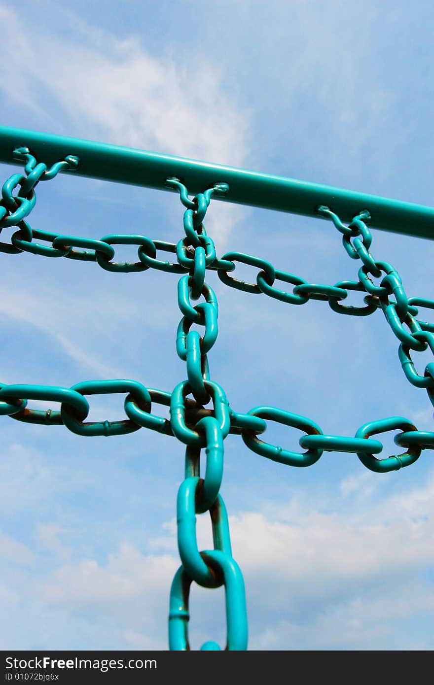 The iron chain of  fitness equipment with a blue sky background in a park .