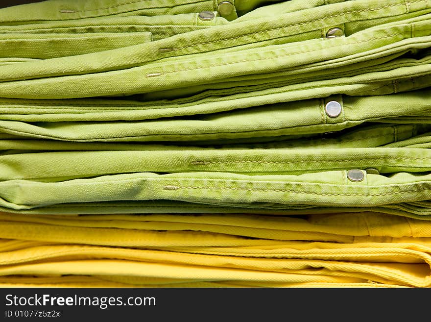 Green and yellow jeans, close-up shot. Green and yellow jeans, close-up shot