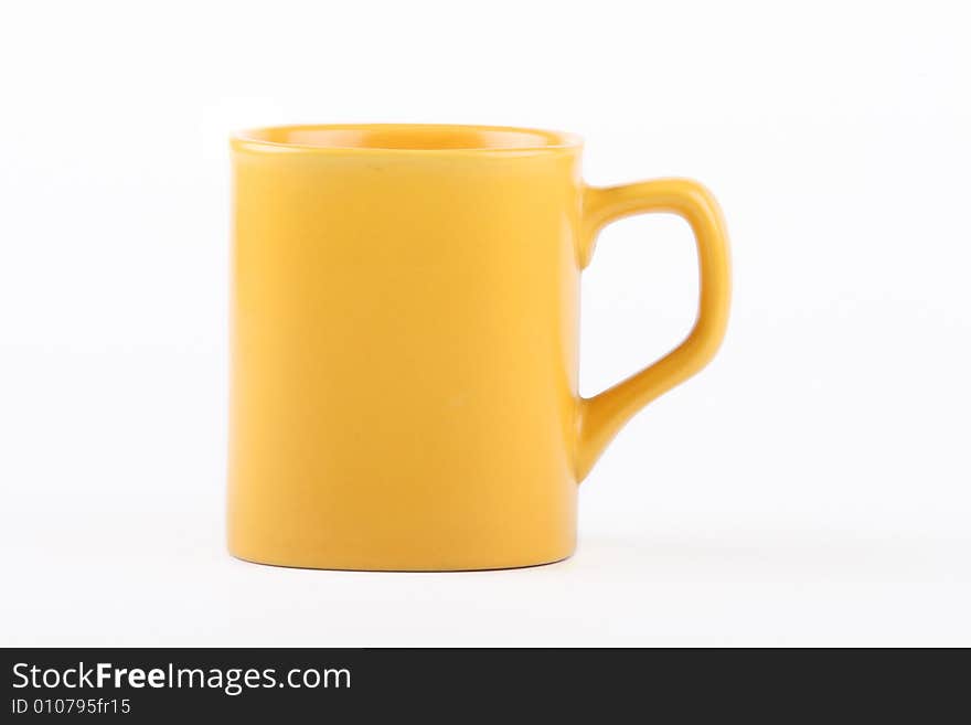 Yellow mug on a white background