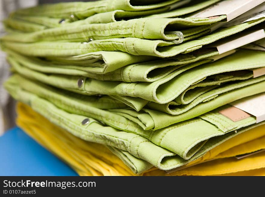 Green and yellow jeans, close-up shot. Green and yellow jeans, close-up shot