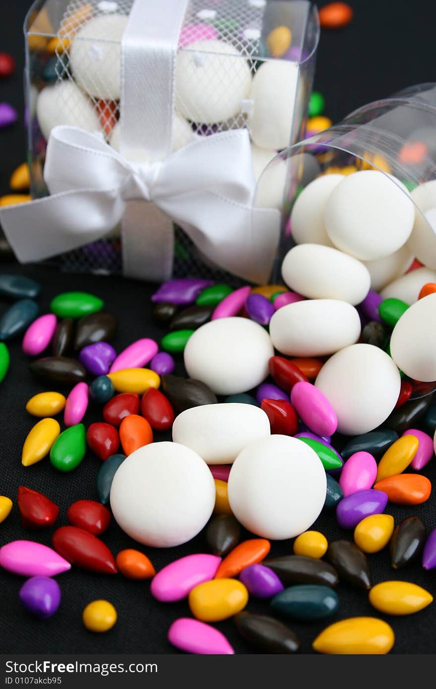 PVC Box decorated with ribbons, containing sweets. PVC Box decorated with ribbons, containing sweets