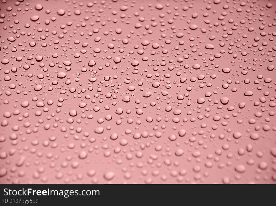 Rain drops on glass window (red background). Rain drops on glass window (red background)