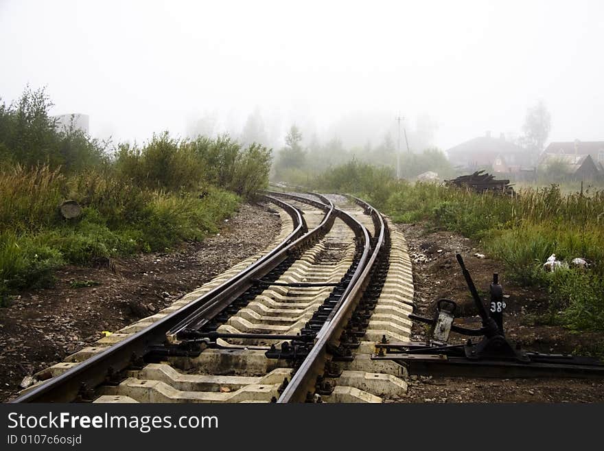 Misterious railway and green grass