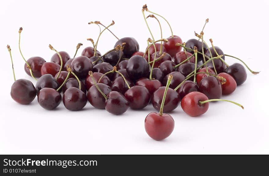 Red cherries on white background