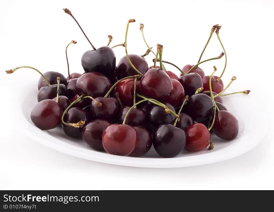 Red cherries on white background