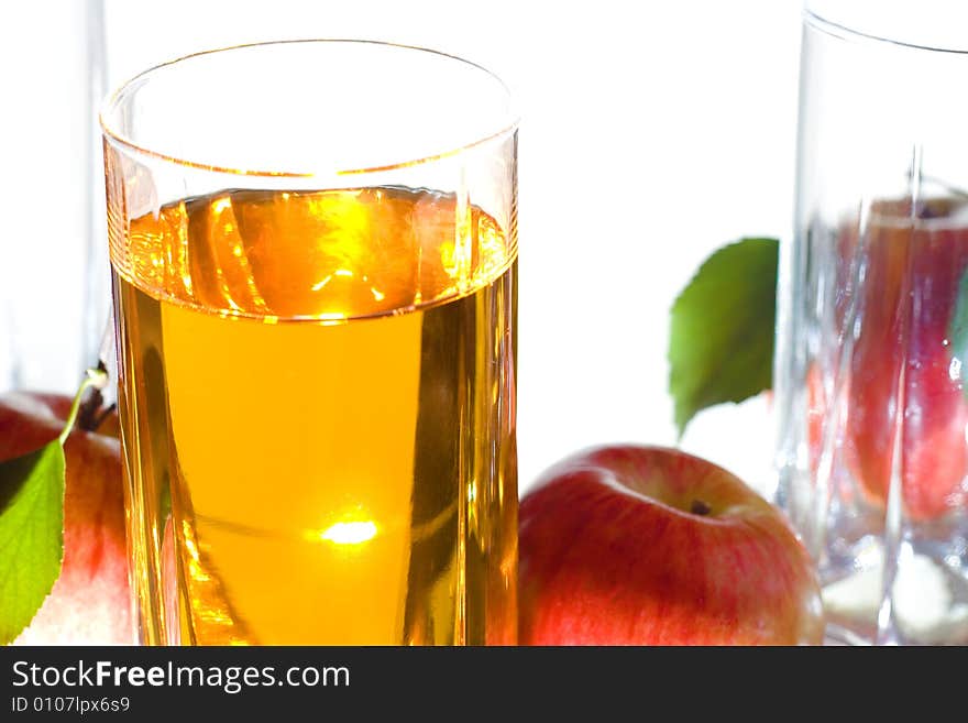 Apples with leaves and juice isolated on white background