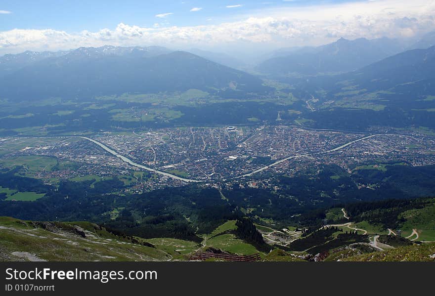 Clouds above the mountains Austrian Alpes . The snow on the rocks. Sight from the peak of Hafelkarspitze mountain . Austria , Tirol . Clouds above the mountains Austrian Alpes . The snow on the rocks. Sight from the peak of Hafelkarspitze mountain . Austria , Tirol .