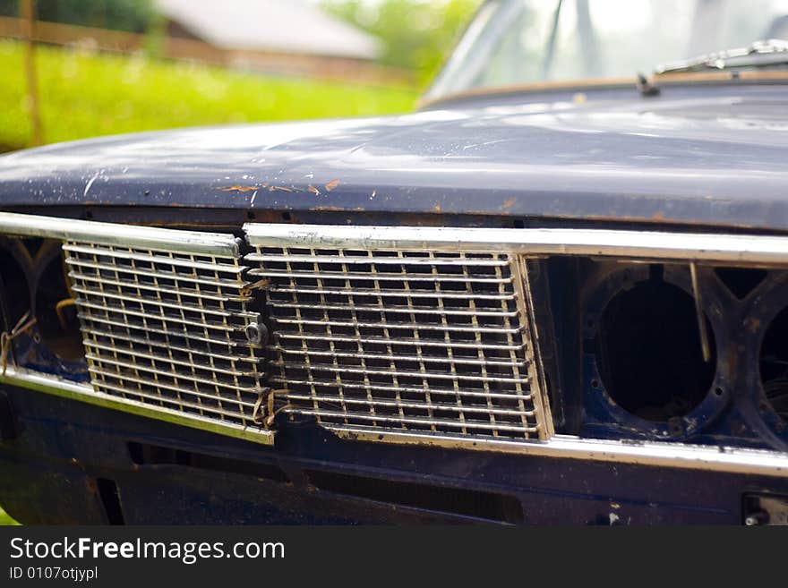 Closeup of old broken car headlight