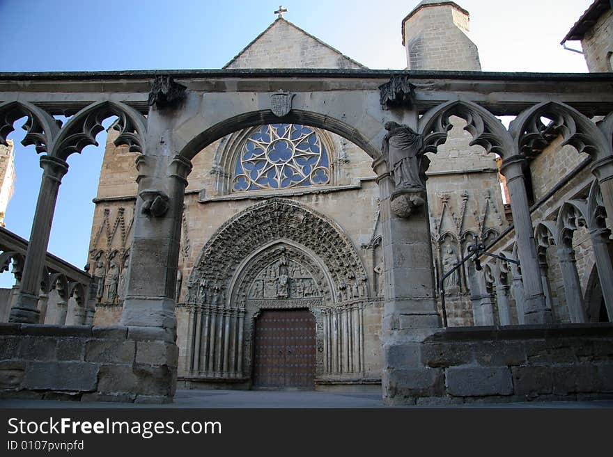 Church through courtyards columns in Olite in Navarra, Spain. Church through courtyards columns in Olite in Navarra, Spain