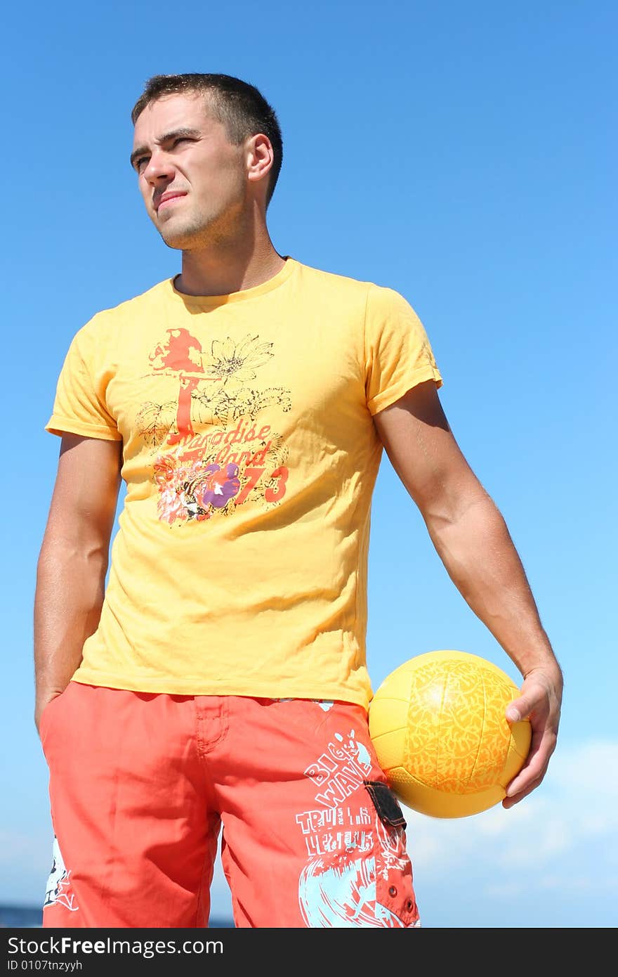 Pretty guy with yellow ball. Pretty guy with yellow ball