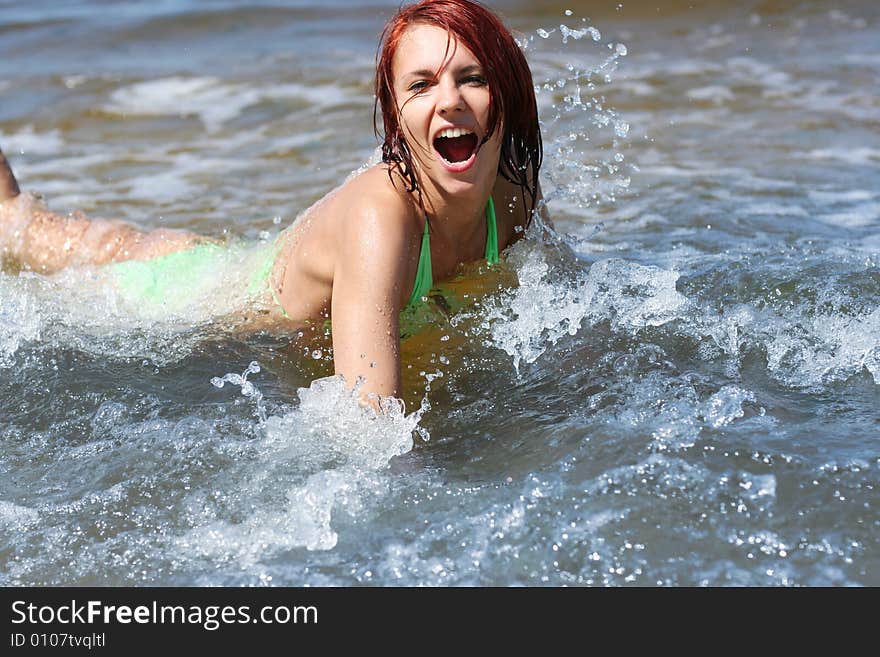 Happy young girl having fun on the sea. Happy young girl having fun on the sea