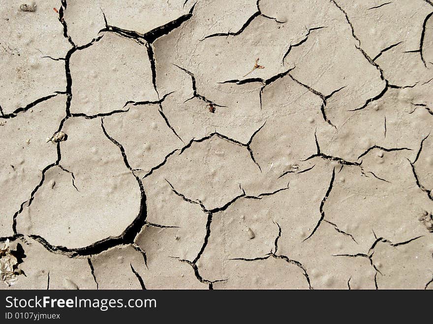 Gray arid mud, background and texture