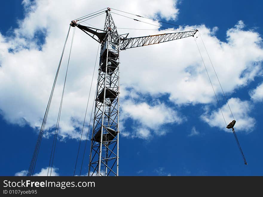 Lifting crane building the house on a construction site