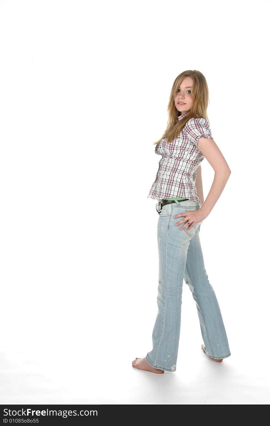 Full length picture of young woman standing with her hand on hip. Full length picture of young woman standing with her hand on hip