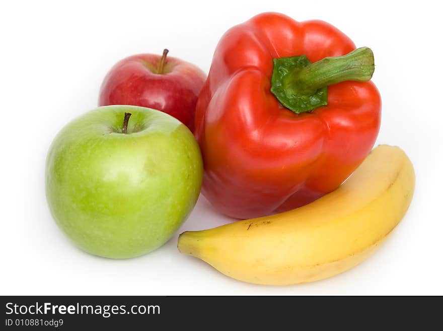 Two apples, banana and red paprika on white background. Two apples, banana and red paprika on white background