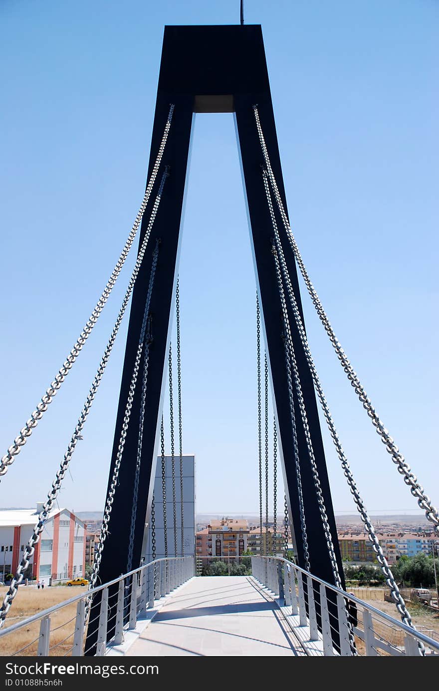 Alone chained bridge and city