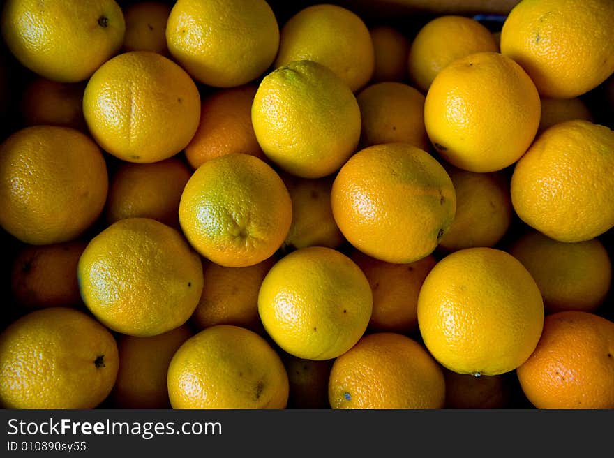 An image of stacked juicy oranges