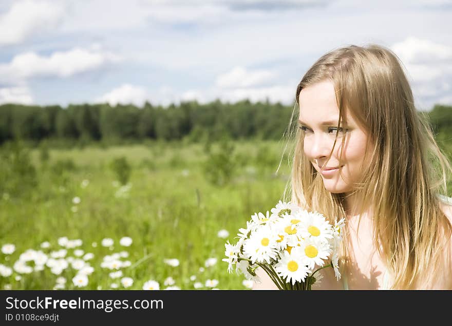 Smiling Woman With Flowers Outdoors