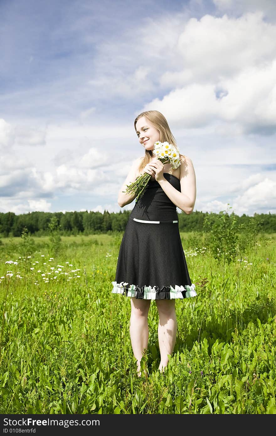 Young Woman With Flowers Outdoors