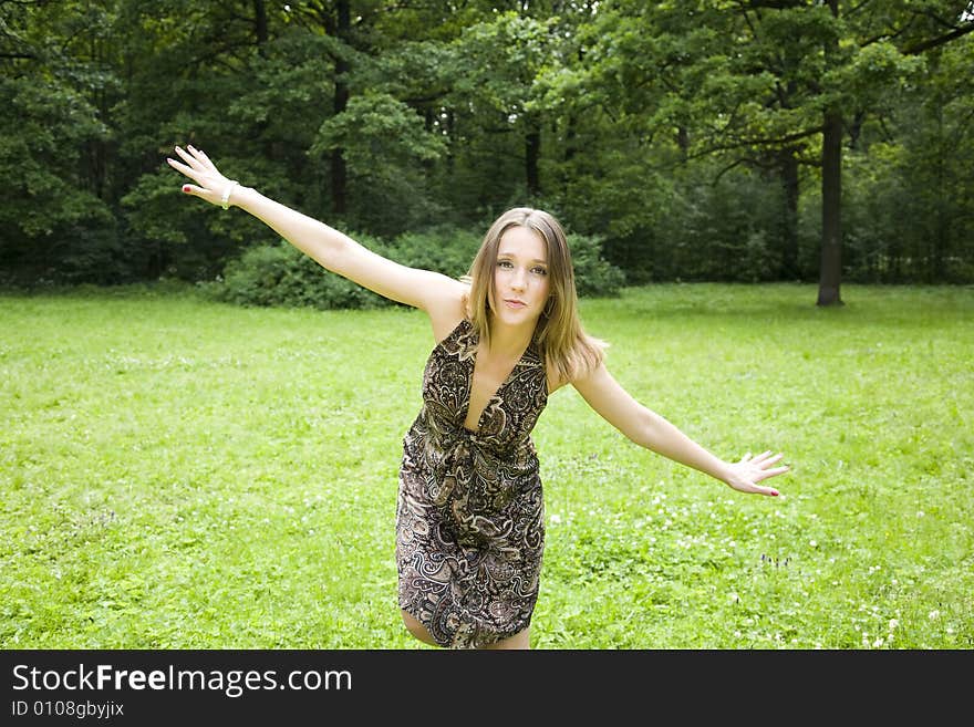 Young Beautiful Woman Playing Outdoors