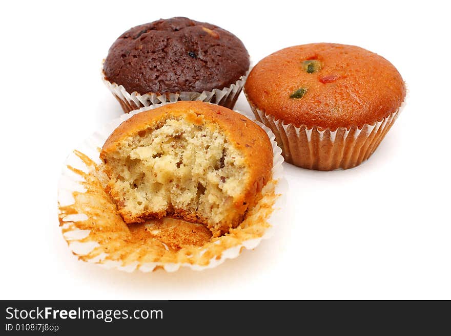 Three different flavor muffins put together on white background.