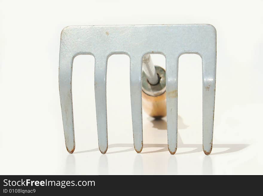 Hand rake against white background