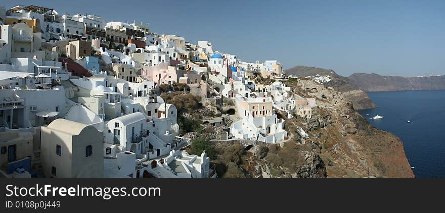 Vibrant cliff-top village in Greece. Vibrant cliff-top village in Greece.