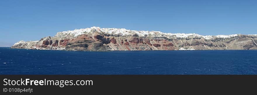 Classic Mediterranean seascape with cliff-top village. Classic Mediterranean seascape with cliff-top village.