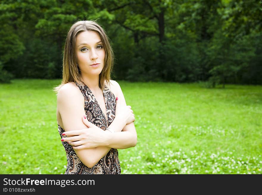 Confident business woman relaxing in the park. Confident business woman relaxing in the park