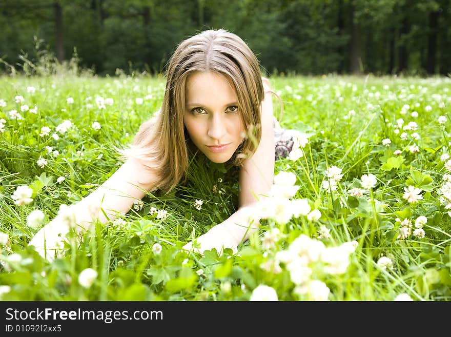 Sexy Young Woman Laying On The Grass. Sexy Young Woman Laying On The Grass