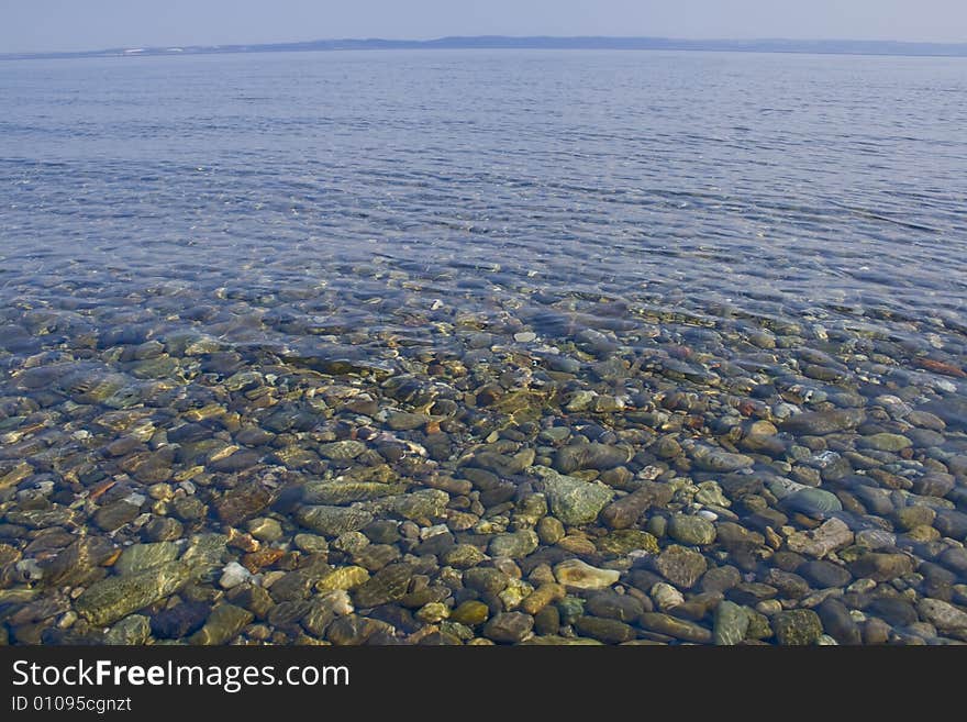 View of stones under deep blue sea. View of stones under deep blue sea