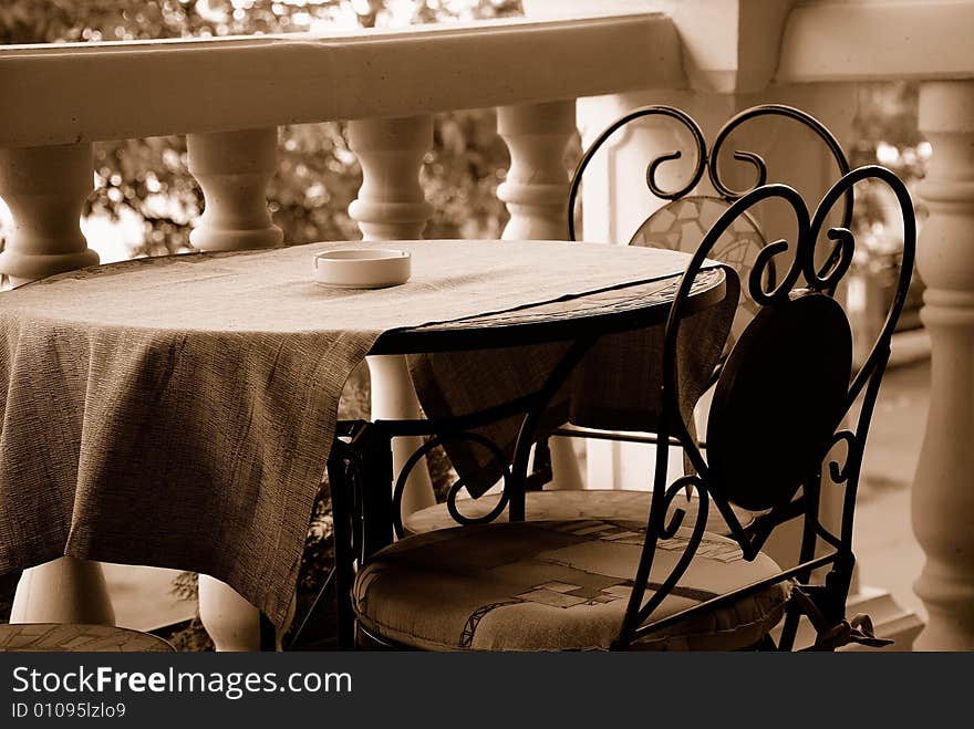 Table and two chairs in sepia color. Table and two chairs in sepia color